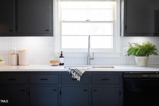 kitchen with dishwasher, tasteful backsplash, and sink