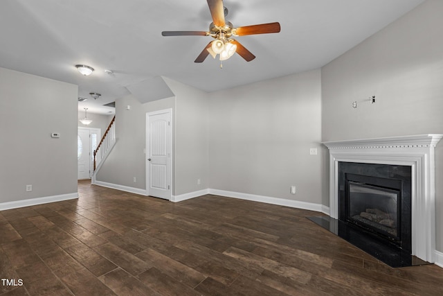 unfurnished living room featuring dark hardwood / wood-style floors and ceiling fan