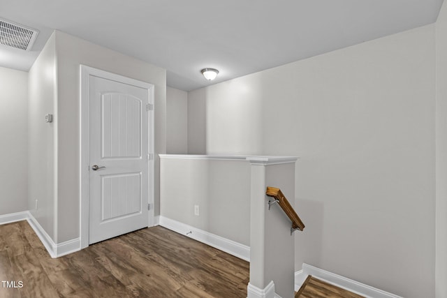 hallway featuring dark wood-type flooring