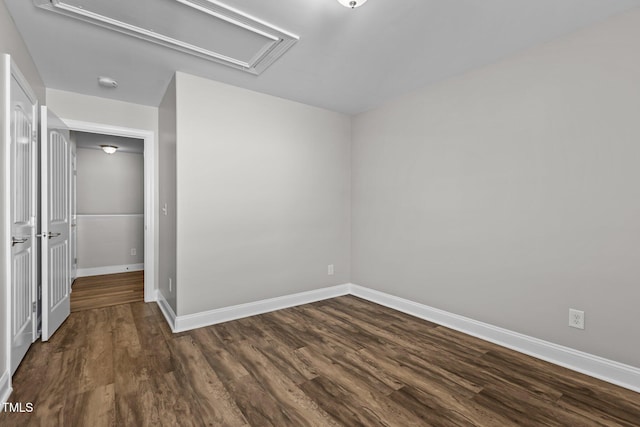 unfurnished room featuring dark hardwood / wood-style flooring