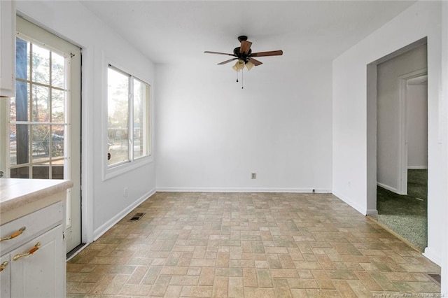 spare room with ceiling fan