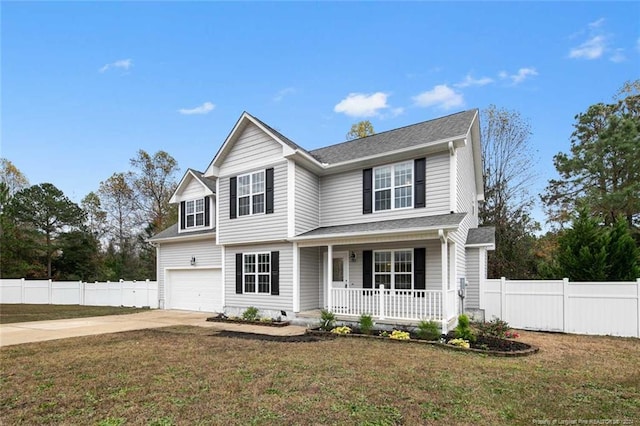 front facade with covered porch, a garage, and a front yard