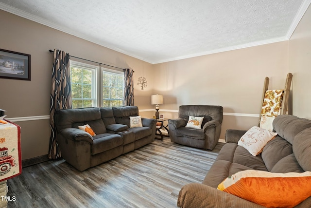 living room featuring crown molding, a textured ceiling, and hardwood / wood-style flooring