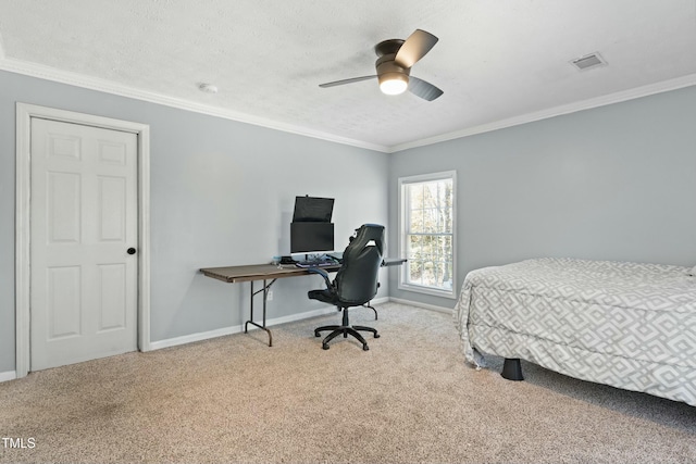 bedroom with a textured ceiling, ceiling fan, ornamental molding, and light carpet