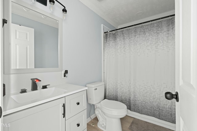 bathroom featuring toilet, vanity, a textured ceiling, and hardwood / wood-style flooring