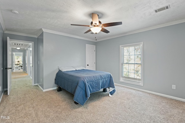 carpeted bedroom featuring ceiling fan, crown molding, a textured ceiling, and multiple windows