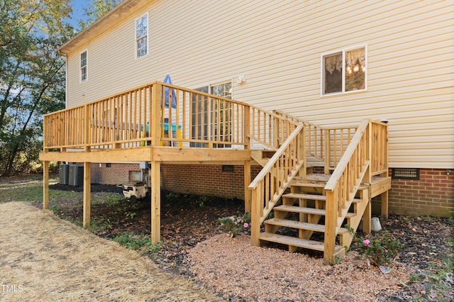 rear view of house featuring a deck