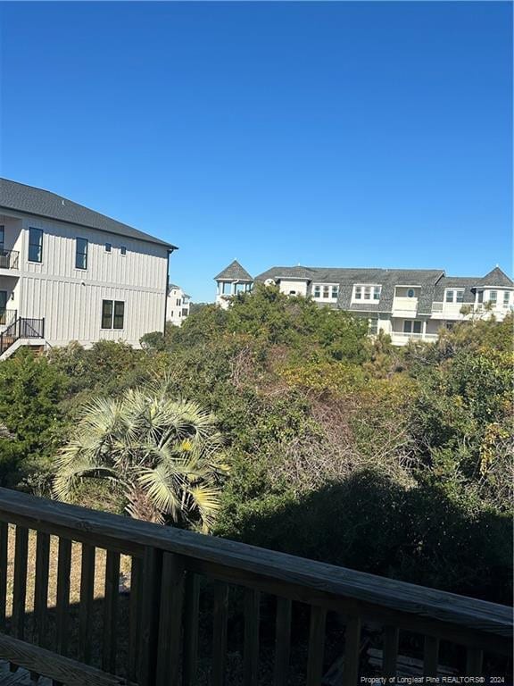 view of yard with a balcony