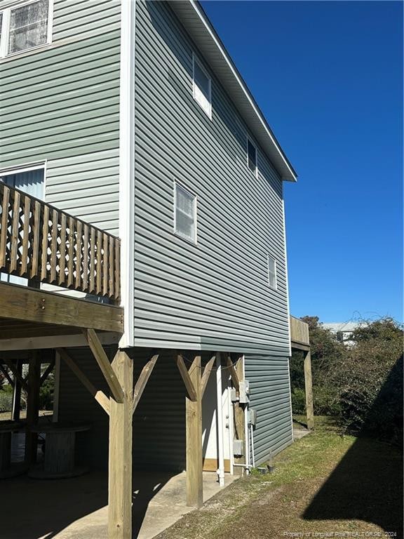 view of side of home with a deck