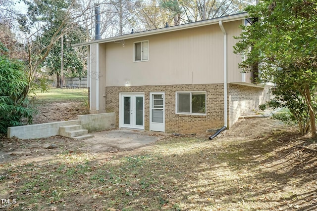 back of property with french doors and a patio