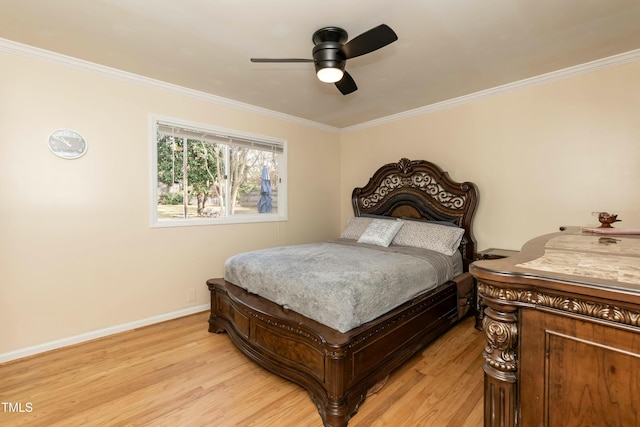 bedroom featuring light hardwood / wood-style flooring, ceiling fan, and crown molding