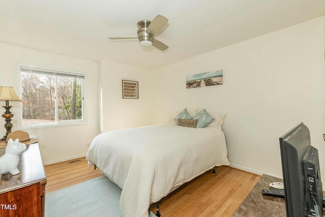 bedroom featuring ceiling fan and light hardwood / wood-style flooring