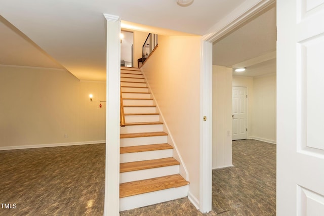 staircase featuring hardwood / wood-style flooring