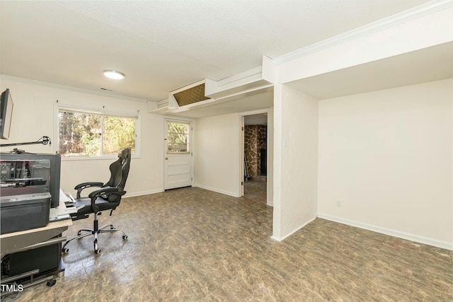 office with a fireplace, wood-type flooring, and crown molding