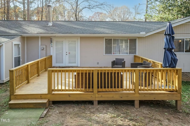 rear view of property featuring a wooden deck