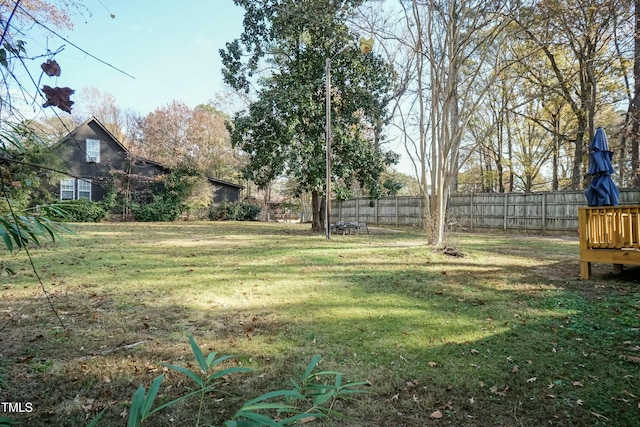 view of yard with a wooden deck