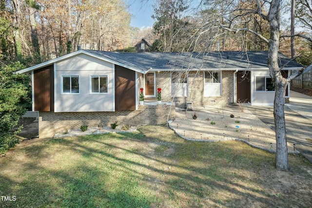 ranch-style house featuring a patio and a front yard