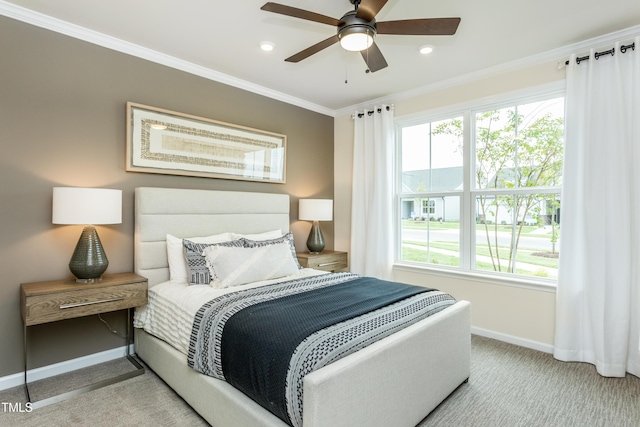 bedroom with light colored carpet, ceiling fan, and ornamental molding