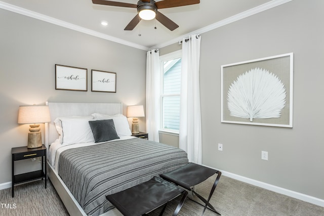 carpeted bedroom with ceiling fan and ornamental molding