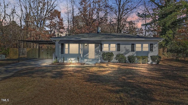 view of front of home with a carport