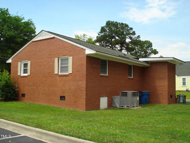 view of property exterior with a yard