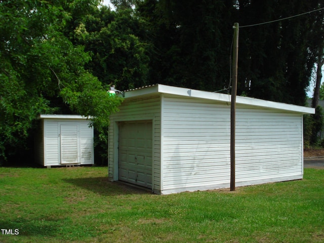 garage with a yard