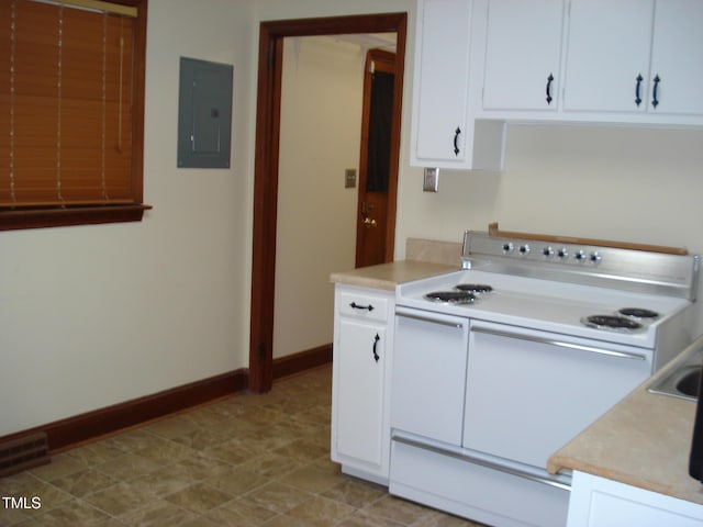 kitchen featuring white cabinets, white electric stove, and electric panel