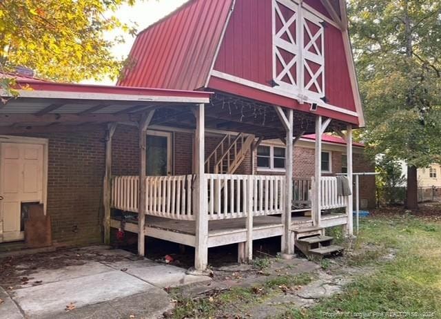 view of side of property with a deck