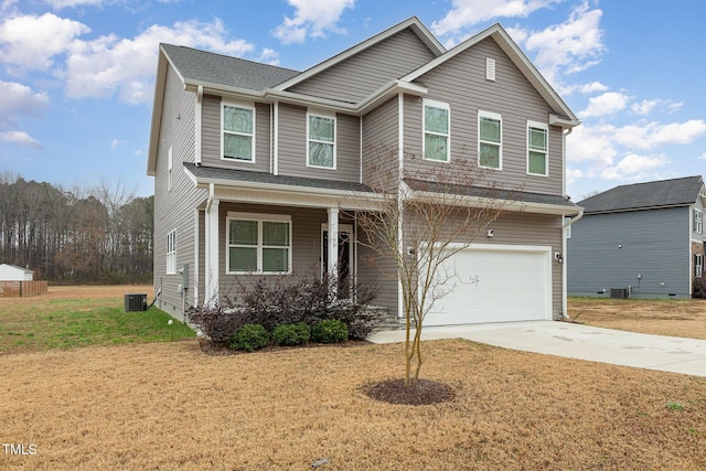 craftsman house with central AC unit, a garage, and a front lawn