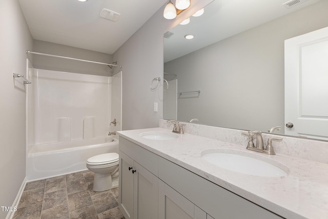 full bathroom with vanity, toilet, and shower / tub combination