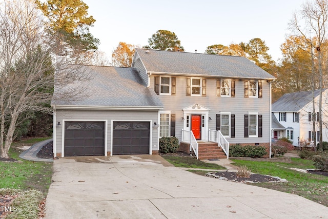 colonial home featuring a garage