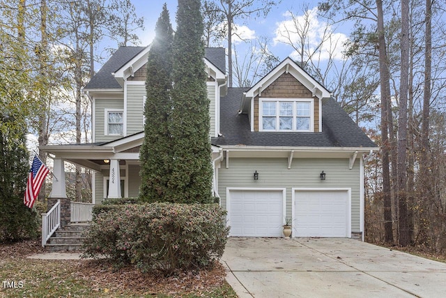 view of front of property featuring a shingled roof and covered porch