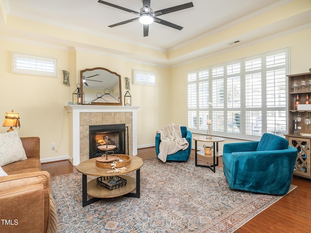 living room with hardwood / wood-style flooring and a healthy amount of sunlight