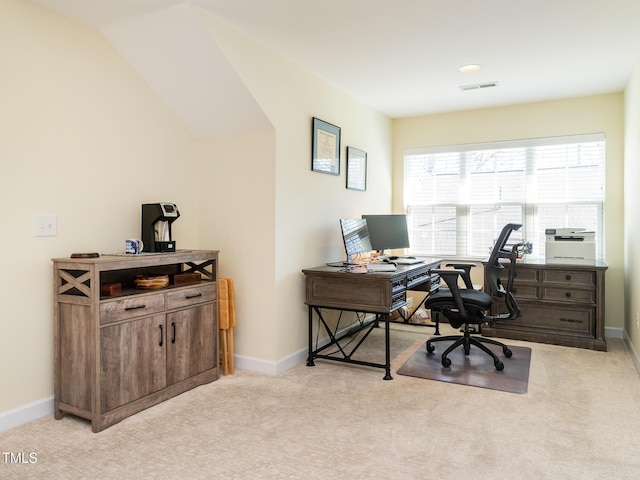 carpeted home office with lofted ceiling