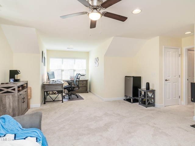 office space featuring ceiling fan and light carpet