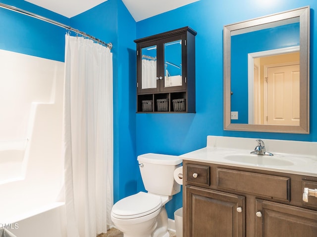 full bathroom featuring vanity, shower / bath combination with curtain, and toilet