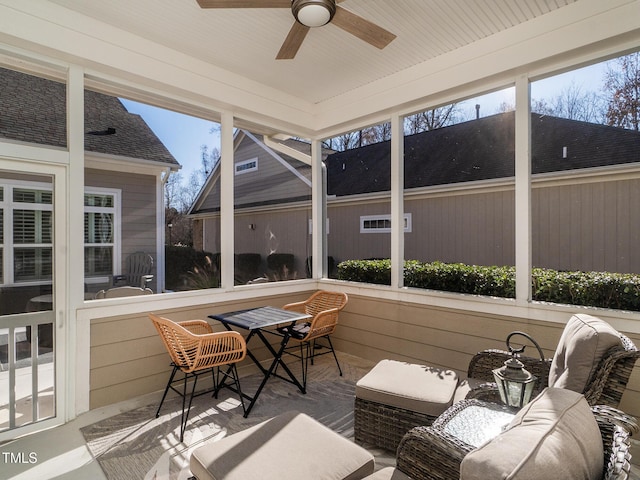 sunroom with ceiling fan and plenty of natural light