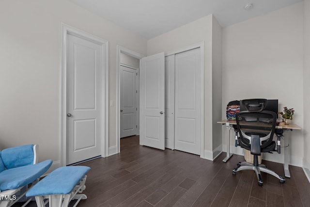 office with dark hardwood / wood-style flooring