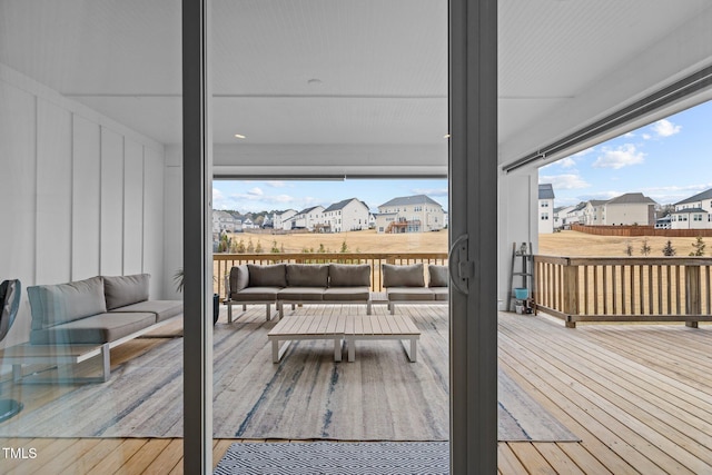 wooden terrace featuring an outdoor hangout area