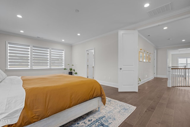 bedroom with dark hardwood / wood-style floors and crown molding