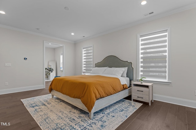 bedroom with dark hardwood / wood-style floors, ornamental molding, and multiple windows