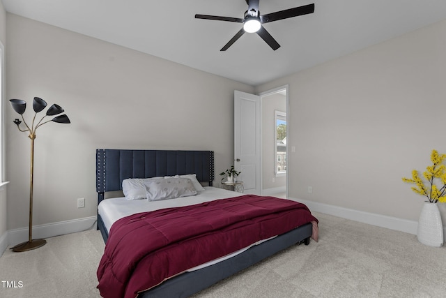 bedroom with ceiling fan and carpet