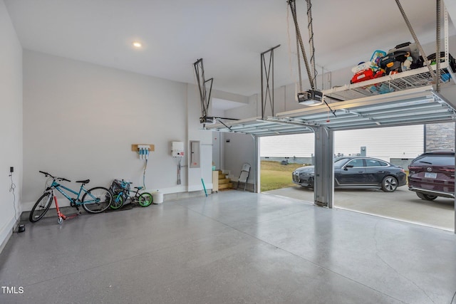 garage with electric panel and a garage door opener