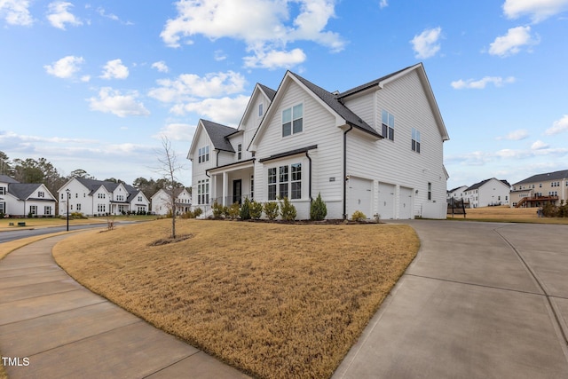 view of property exterior with a yard and a garage