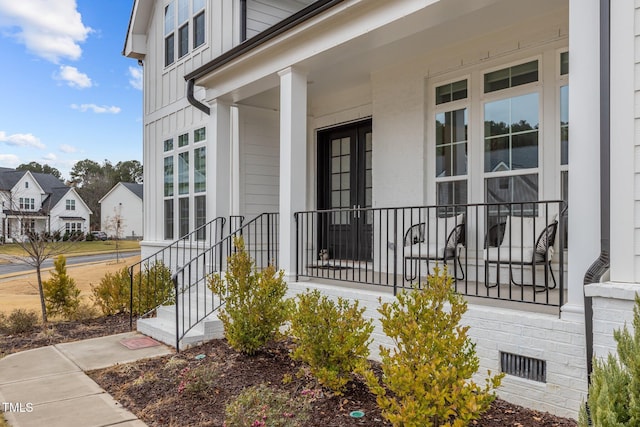 entrance to property featuring a porch