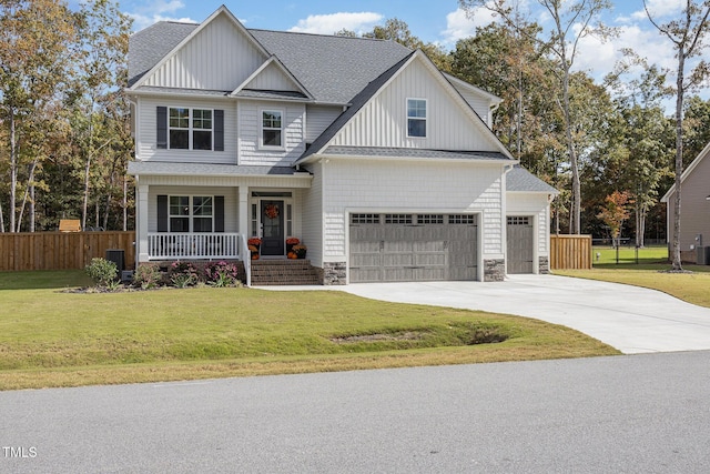 craftsman inspired home with a front yard and covered porch