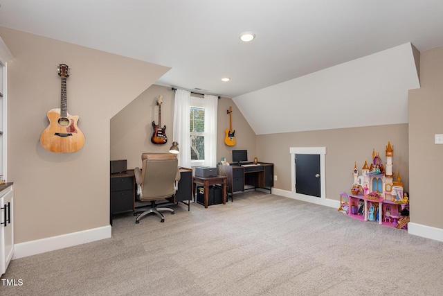 office area featuring vaulted ceiling and carpet flooring