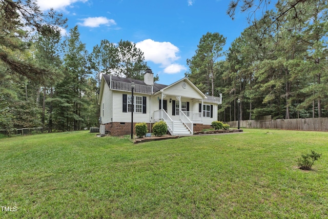 view of front of property with covered porch and a front yard