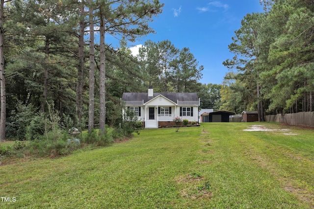 view of front of home featuring a front lawn and a carport