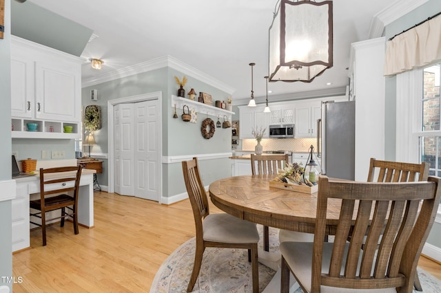 4027 Green Forest Ct, Rocky Mount, NC 27804 - dining room with light hardwood / wood-style flooring and ornamental molding